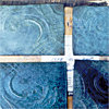 sample tiles of a patina applied different ways